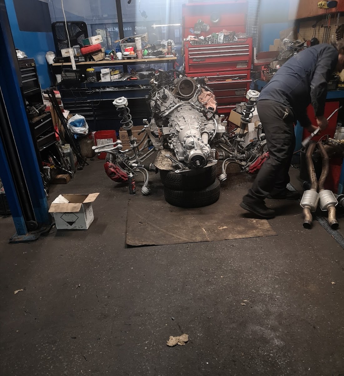 Volkswagen and Audi vehicles in the workshop bays